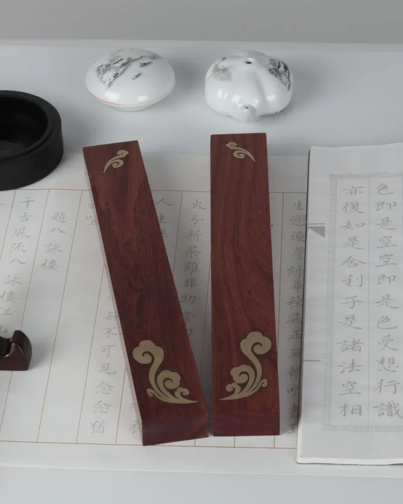 Chinese characters written with a brush on practice paper